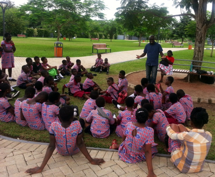 Alex and students by tree